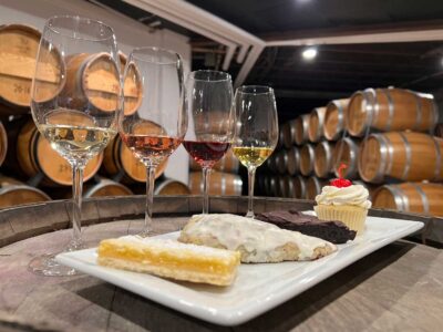4 desserts and 4 wine glasses with tasting samples
